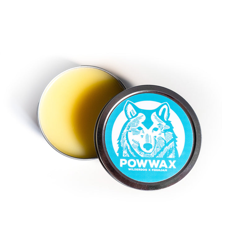 Round tin of POWWAX, lid partly off, showing yellow wax.